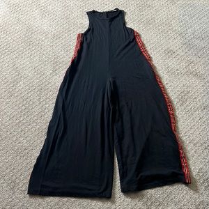 Zara Black oversized jumpsuit with red/white/black tuxedo stripe.